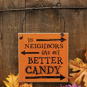 The Neighbors Give Out Better Candy Distressed Wooden Hanger