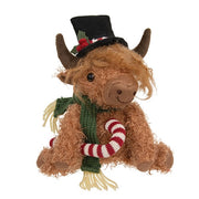 Sitting Highland Cow with Candy Cane