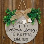 The Dog Knows You're Here Round Sign with Greenery & Burlap Bow