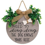 The Dog Knows You're Here Round Sign with Greenery & Burlap Bow